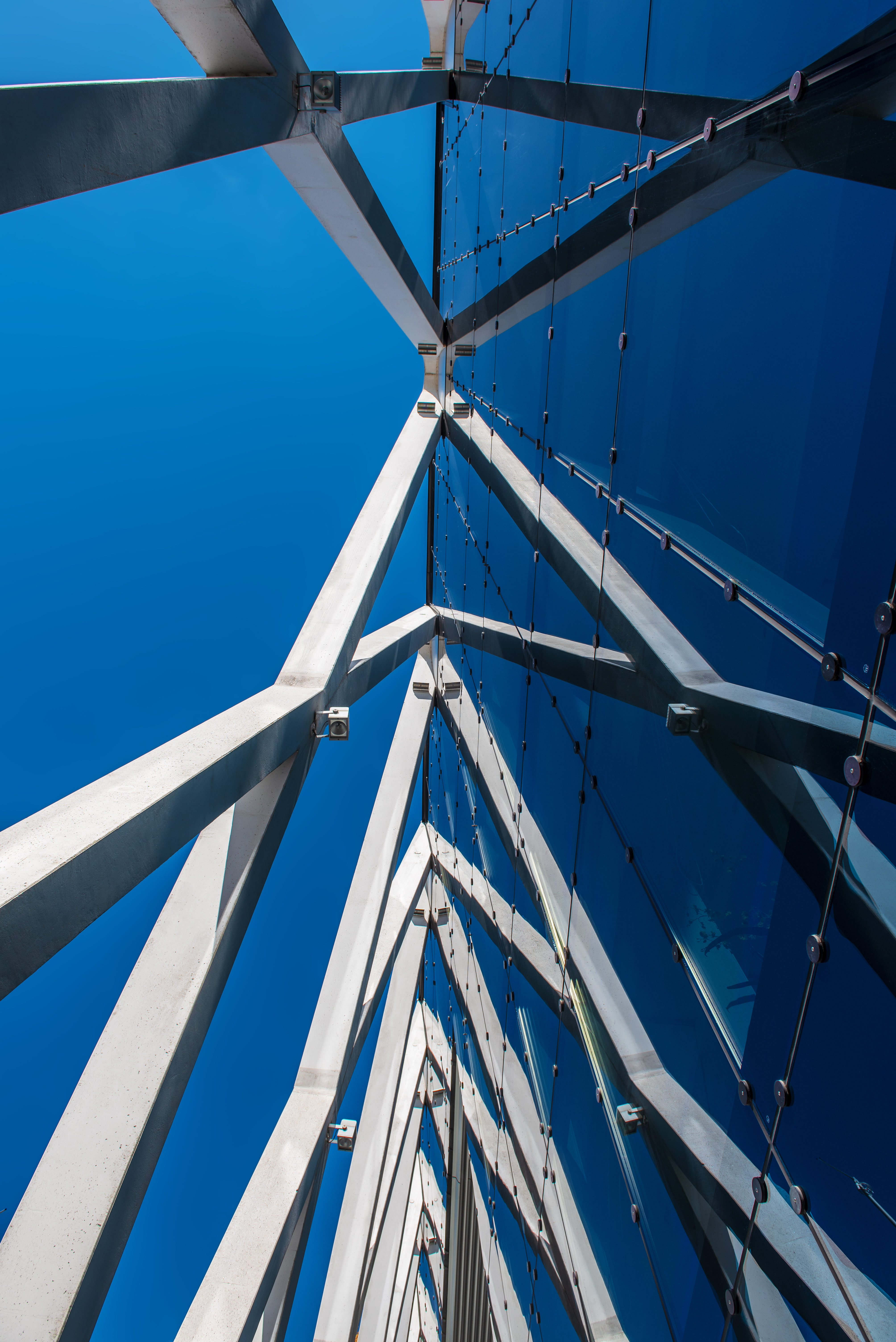 Abstract architecture background with blue sky and modern office building with reflection in the window glass